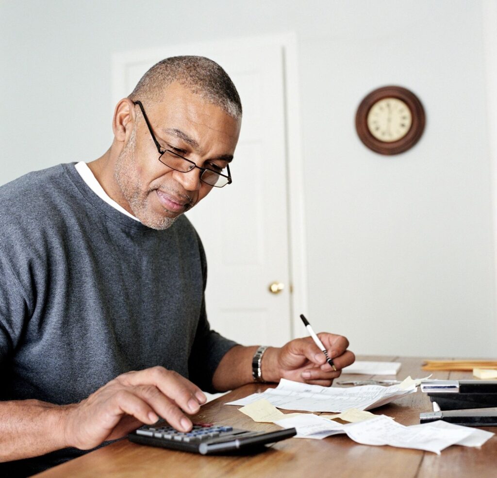 A man calculating finances
